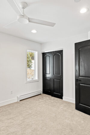 Custom Mountain Home - Empty Bedroom Leading to Hallway