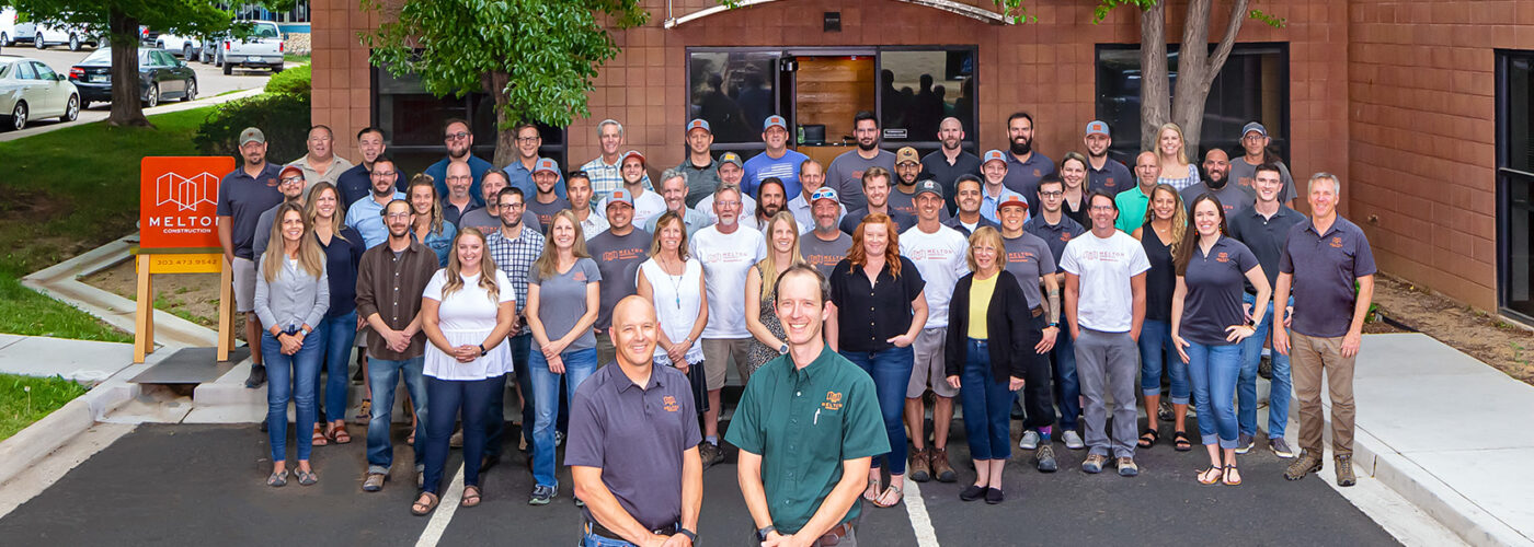 The full Melton Design Build team standing outside the home office in Boulder, Colorado